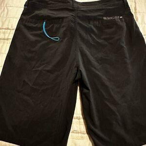 Men's black quick silver board shorts, size 36